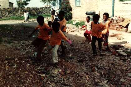Children Playing Football In The Street