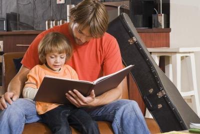 Children Reading Books With Parents